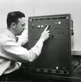 David Hagelbarger (who built the first outguessing machine), with his device. Image from http://wpoundstone.blogspot.com/2014/07/how-i-beat-mind-reading-machine.html